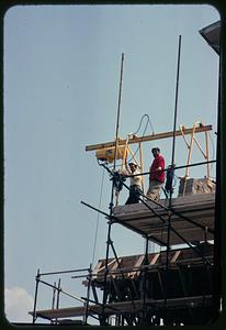 Construction workers on scaffolding, Rome