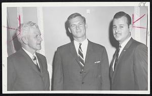 Newly formed State Automobile Advisory Committee discusses seat belt study with Gov. Peabody. At left, John A. Rooney, Boston Herald-Traveler Automotive editor, Gov. Peabody, and Herbert A. Abramson, president Silver Lake Motors, Inc., Newton.