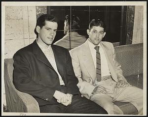 Freshman Infielders of Chicago White Sox are these two young men killing time at the Hotel Kenmore before today’s scheduled game with the Red Sox. At the left is Rocco Krsnich, Chicago third-baseman, while at the right is Willie Miranda, fielding flash from Cuba and utility infielder.