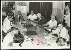 Striking Teachers, school committee members and New Bedford Mayor Edward Harrington (seated at extreme right) meet at City Hall in negotiating session.