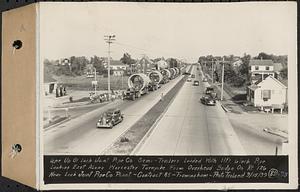 Contract No. 85, Manufacture and Delivery of Precast Concrete Steel Cylinder Pipe, Southborough, Framingham, Wayland, Natick, Weston, line up of Lock Joint Pipe Co. semi-trailers loaded with 11ft. 6 inch pipe looking east along Worcester Turnpike from overhead bridge on Rt. 126 near Lock Joint Pipe Co. plant, Framingham, Mass., Sep. 15, 1939