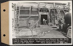 Contract No. 80, High Level Distribution Reservoir, Weston, close-up showing bronze door frames, and plaques on the south side of the gatehouse, high level distribution reservoir, Weston, Mass., Jul. 23, 1940