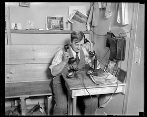 Leslie Jones on two telephones