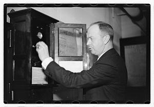 A man demonstrating how to break into a safe