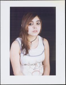 Portrait of young woman in white tank tops