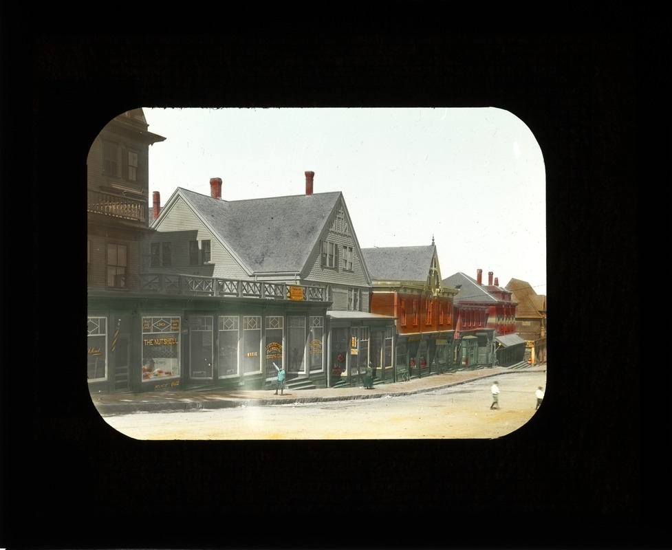 Wollaston stores. (color). 1920s. Newport Ave across from Wollaston depot. "The Nutshell" (store)
