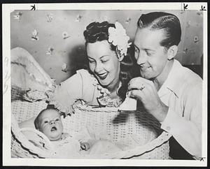 Plan for Baby’s Future-Mr. And Mrs. Roy Shipstad (Bess Ehrhardt), two of the nation’s best known ice-skating performers, show their two-month-old daughter, Jill Marie, her first pair of skates at their home in Hillsborough, Calif.