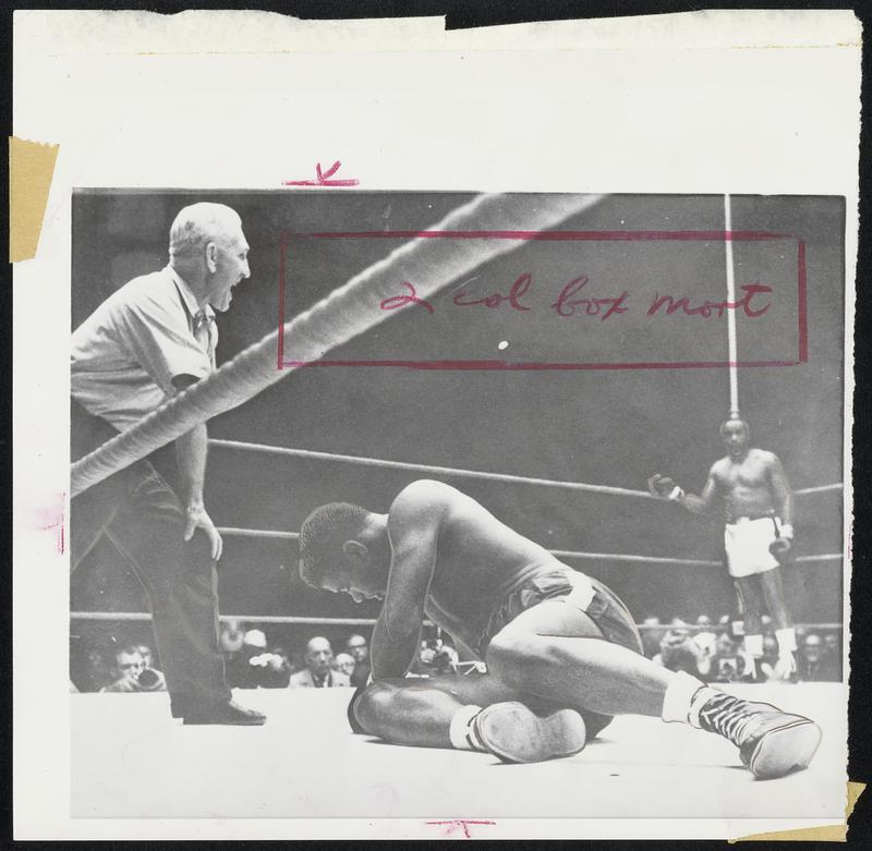 Fallen Floyd Patterson is in the process of becoming an ex-champ as referee intones the count after knockdown by Sonny Liston (in neutral corner.) the end came at 2:06 of first round of last night's bout in Chicago.