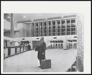 San Francisco – No Planes Today – R. Hall, of Hayward, Calif., stands all alone in near empty International Airport in San Francisco, today. Flights were cancelled due to the wildcat strike of flight engineers. Some 70 scheduled outbound flights were cancelled.