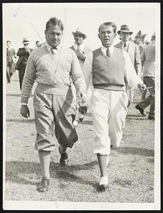 They didn’t do so well. Bobby Jones, the grand slam golfer, and Paul Runyan, a fair golfer himself, photographed during the first day’s play of the $5,000 Masters’ invitation tournament at Augusta, GA., March 22. They played together, but neither did much good, Jones coming in with a 76, four over par, and Runyan just two strokes better. Jones’ putter gave him trouble. Horton Smith, Emmeth French, and Jimmy Hines led the field with 70’s.