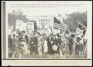 Passing the White House- Participants in today's "March for victory" pass south of the White House on their way to a rally on the nearby Washington Monument grounds.