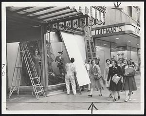 Ounce of Prevention was taken by this Tremont street store, where plate glass windows were boarded up in preparation for the hurricane.