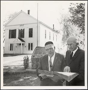 Paul F. Field and William E. Sanderson standing in front of the town hall