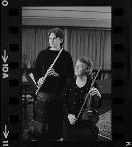 Florence Chapman Pearson seated with violin and Lea Pearson with flute