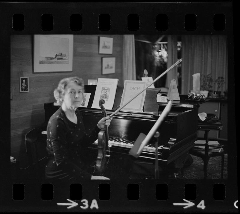 Florence Chapman Pearson seated with violin near piano