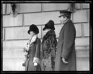 Two unidentified women and one unidentified man