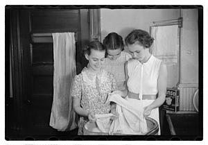 Women doing laundry with a washing machine