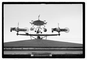 An elaborate device on roof, possibly a weather vane