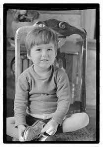Toddler sitting on a chair