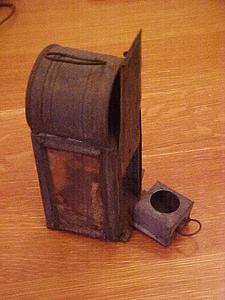 Metal lantern with a candle holder