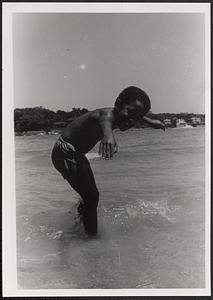 James posing in the surf at the beach