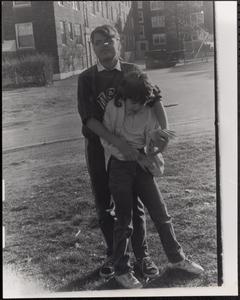 April Postell and another child hugging