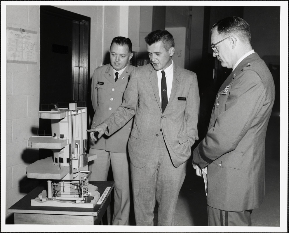 O'Connor, Black, and man observing Horace Hardy Lester Reactor model