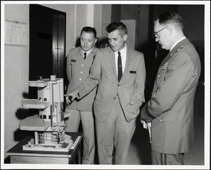 O'Connor, Black, and man observing Horace Hardy Lester Reactor model