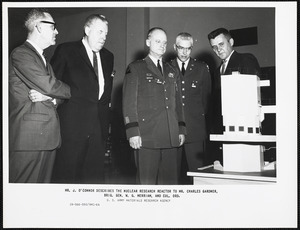 Mr. J. O'Connor describes the nuclear research reactor to Mr. Charles Gardner, Brig. Gen. W. G. Merriam, and Col. Ord.