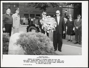 Louis Batas, International Association of Machinists, and Edward LeMay, Retirement Association, place wreath on Veterans plaque, representing all employee organizations