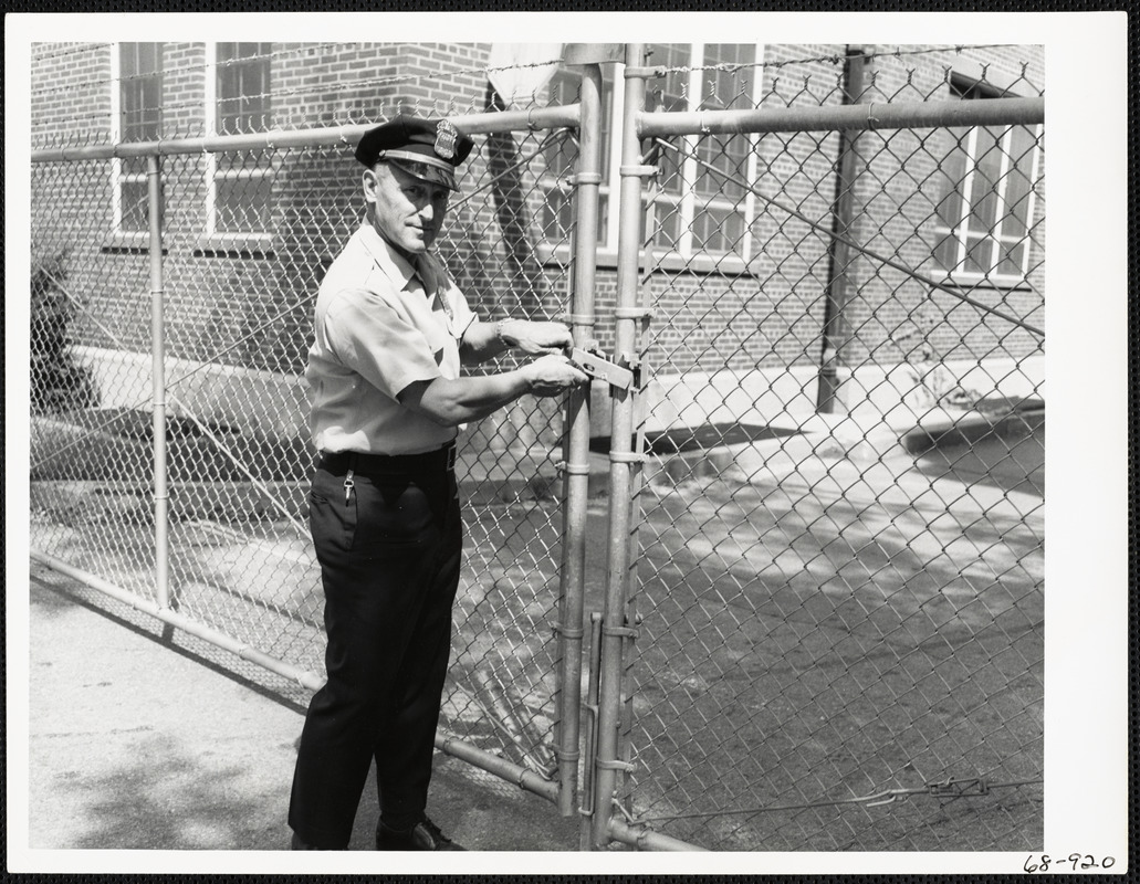 Officer unlocking gate