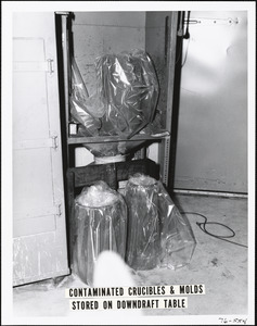 Contaminated crucibles & molds stored on downdraft table
