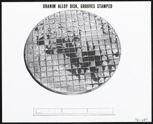 Uranium alloy disk, grooves stamped