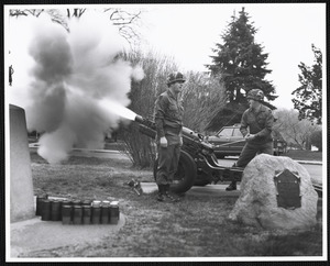 Military officers firing cannon