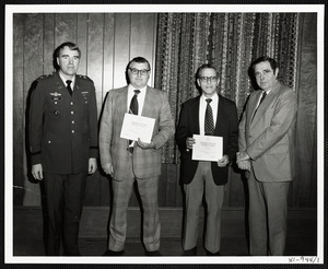 Men receiving Department of the Army Certificate of Service awards