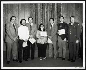 Men and woman receiving Department of the Army Certificate of Service awards