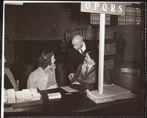 Women at table taking