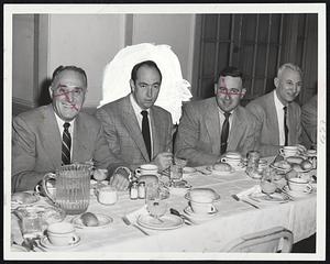 Hoop Coaches Get Together at weekly basketball writers’ luncheon at the Hotel Lenox today. They are (left to right) Doggie Julian of Dartmouth, Woody Grimshaw of Tufts, Dino Martin of Boston College and Norm Shepard of Marvard. Julian, in first appearance, asked for legislation against zone defense.