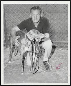 Raynham Racers - Chuck Rink, one of the top greyhound owner-trainers in the country, poses with Loud, a young greyhound who will be racing at Raynham Park, which opened its 56-night meeting last night.