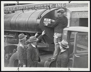 Emergency Fuel Delivery for hospitals being permitted to pass through the picket line of striking oil workers at the Beacon Oil plant, Everett, yesterday. Ernest Pelletier of Local 381, CIO, affixes the “Emergency” sign, with the approval of other pickets.