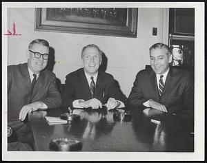 Creating Special Board of city officials deal with complaints from families without beat. Mayor White Kevin (center) recaps plans with Deputy Mayor Edward T. Sullivan (left) and Daniel J. Finn, housing inspection commissioner, after conference with department heads in city Counsil committee room.