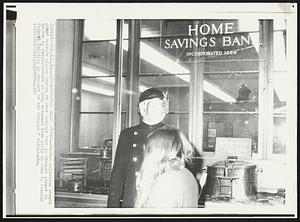 Boston – Demonstrators Break Window – Boston policeman stands guard outside window broken at Home Savings Bank on Tremont street in Boston by demonstrators as they returned from rally at John F. Kennedy Federal Building in support of the Chicago 7 defendants.