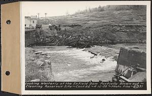 Contract No. 62, Clearing Lower Middle and East Branches, Quabbin Reservoir, Ware, New Salem, Petersham and Hardwick, looking westerly at the Enfield Dam partially blown out, Enfield, Mass., Apr. 12, 1939