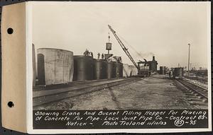 Contract No. 85, Manufacture and Delivery of Precast Concrete Steel Cylinder Pipe, Southborough, Framingham, Wayland, Natick, Weston, showing crane and bucket filling hopper for placing of concrete for pipe, Natick, Mass., Nov. 10, 1939