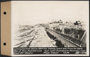 Contract No. 80, High Level Distribution Reservoir, Weston, looking east from Sta. 889+10+/- showing invert and forms for upper pipe of twin aqueduct line, high level distribution reservoir, Weston, Mass., Apr. 2, 1940