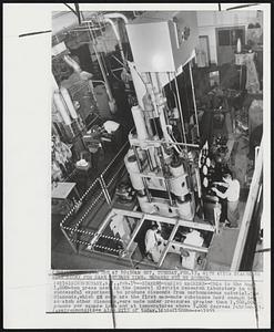 Diamond-Making Machine--This is the huge 1,000-ton press used in the General Electric Research Laboratory in the successful experiment to produce diamonds from carbonaceous material. The diamonds, which GE says are the first man-made substance hard enough to scratch other diamonds, were made under pressures greater than 1,500,000 pounds per square inch and at temperatures above 5,000 degrees Fahrenheit.