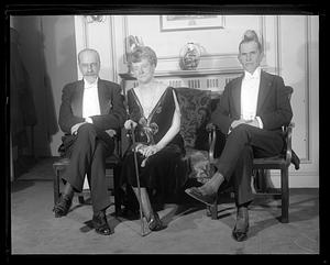 Three unidentified people in formal clothing