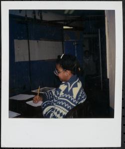 Girl sitting and writing