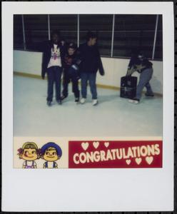 Group of children ice skating together
