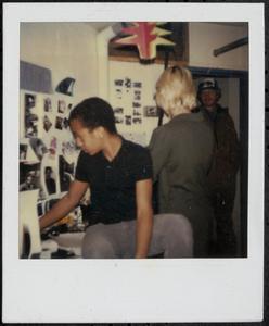 Group of people looking at photo wall